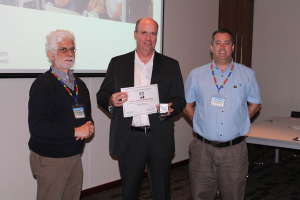 Award being presented to Professor Whittaker